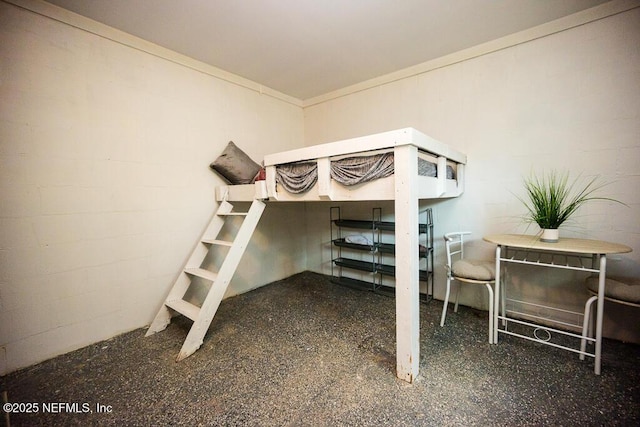 831 Ashford St, Jacksonville, FL 32208 - bedroom with concrete block wall and speckled floor
