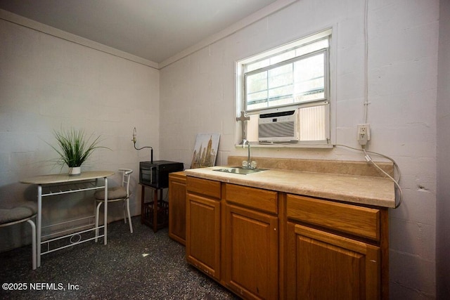 831 Ashford St, Jacksonville, FL 32208 - kitchen with a sink, brown cabinets, light countertops, cooling unit, and crown molding