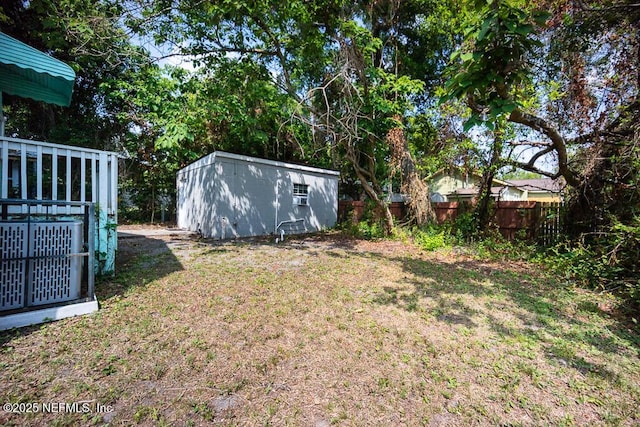 831 Ashford St, Jacksonville, FL 32208 - view of yard with central AC, an outdoor structure, and a storage unit