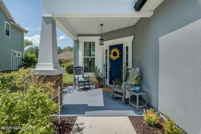 489 Citrus Ridge Dr, Ponte Vedra, FL 32081 - doorway to property with covered porch and stucco siding