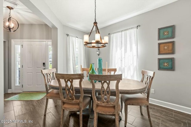 489 Citrus Ridge Dr, Ponte Vedra, FL 32081 - dining area with a chandelier, wood finish floors, and a healthy amount of sunlight