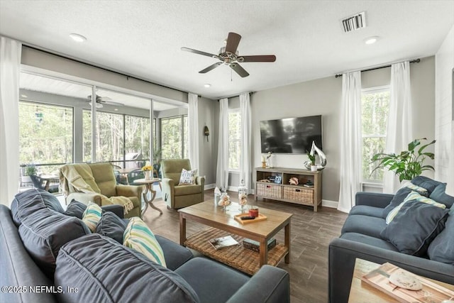 489 Citrus Ridge Dr, Ponte Vedra, FL 32081 - living area with ceiling fan, dark wood-type flooring, a textured ceiling, visible vents, and baseboards