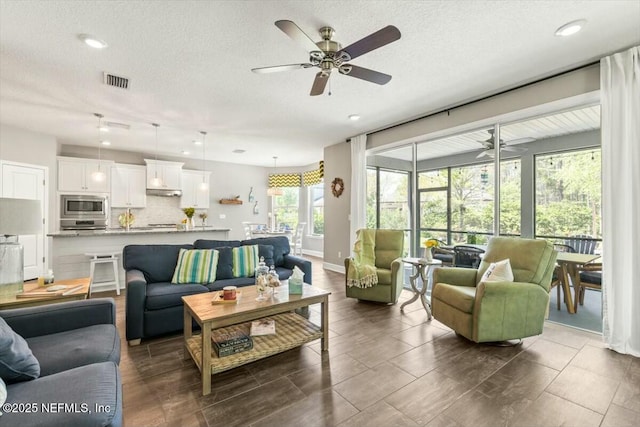 489 Citrus Ridge Dr, Ponte Vedra, FL 32081 - living room featuring a textured ceiling, a ceiling fan, visible vents, and recessed lighting