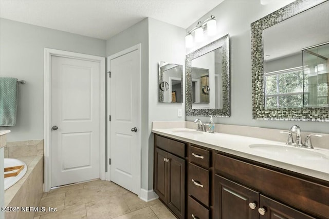 489 Citrus Ridge Dr, Ponte Vedra, FL 32081 - bathroom with tile patterned floors, double vanity, a garden tub, and a sink