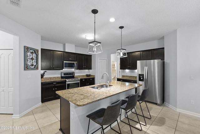 169 S Field Crest Dr, Saint Augustine, FL 32092 - kitchen featuring visible vents, appliances with stainless steel finishes, a sink, light tile patterned floors, and baseboards