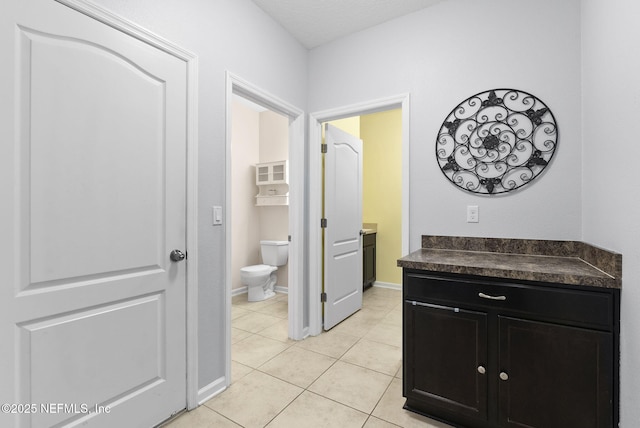 169 S Field Crest Dr, Saint Augustine, FL 32092 - bathroom featuring vanity, baseboards, tile patterned floors, and toilet