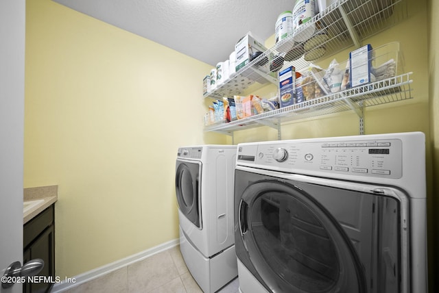 169 S Field Crest Dr, Saint Augustine, FL 32092 - laundry area with separate washer and dryer, laundry area, light tile patterned floors, and baseboards