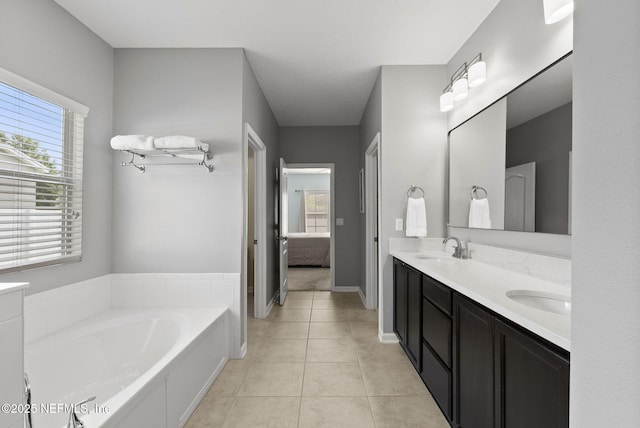 169 S Field Crest Dr, Saint Augustine, FL 32092 - ensuite bathroom with double vanity, a bath, a sink, tile patterned floors, and ensuite bath