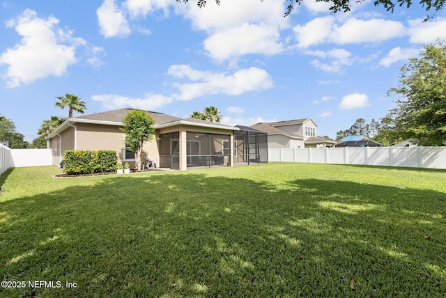 169 S Field Crest Dr, Saint Augustine, FL 32092 - rear view of house with a fenced backyard, stucco siding, and a yard