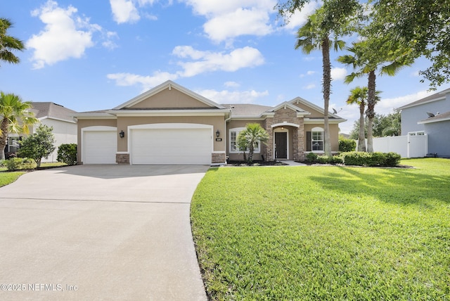 169 S Field Crest Dr, Saint Augustine, FL 32092 - view of front of home with an attached garage, driveway, a front lawn, and stone siding