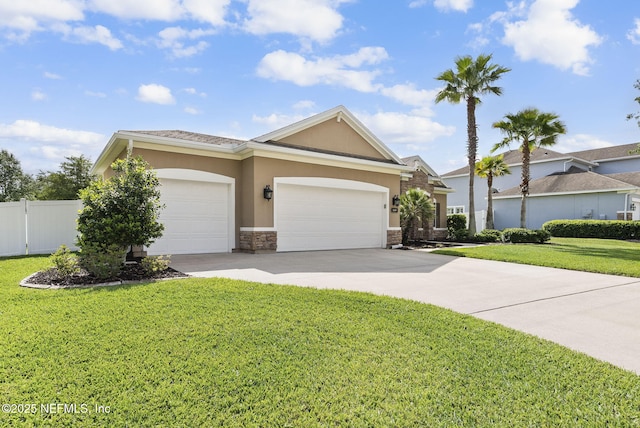 169 S Field Crest Dr, Saint Augustine, FL 32092 - ranch-style home featuring a garage, stone siding, a front yard, stucco siding, and driveway