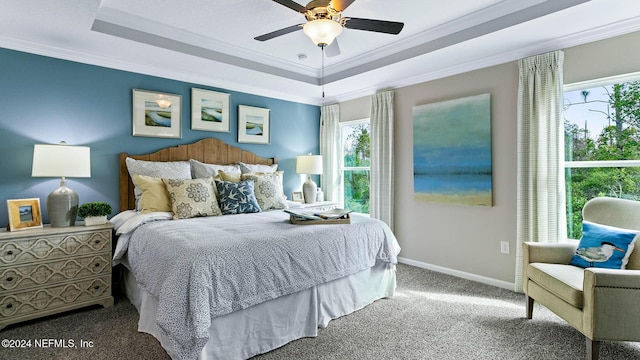 173 Greenwood Dr, Palm Coast, FL 32137 - bedroom with baseboards, ceiling fan, crown molding, a tray ceiling, and carpet flooring