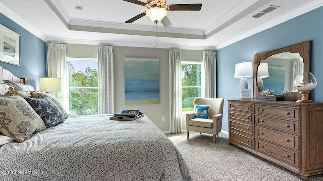 173 Greenwood Dr, Palm Coast, FL 32137 - bedroom featuring light carpet, visible vents, ornamental molding, and a raised ceiling