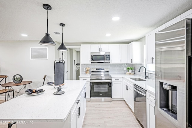 310 Capella Rd, Orange Park, FL 32073 - kitchen featuring a sink, visible vents, light countertops, and stainless steel appliances