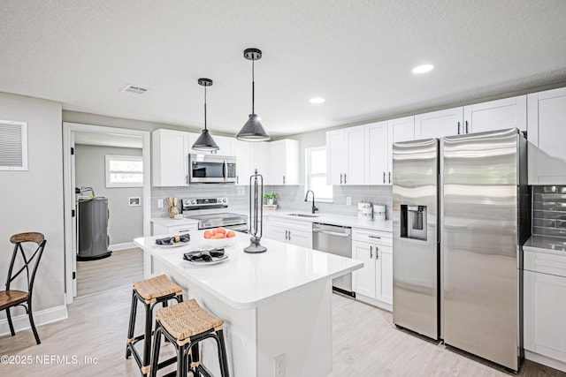 310 Capella Rd, Orange Park, FL 32073 - kitchen featuring stainless steel appliances, plenty of natural light, a sink, and backsplash