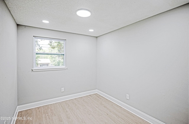 310 Capella Rd, Orange Park, FL 32073 - unfurnished room featuring a textured ceiling, wood finished floors, baseboards, and recessed lighting
