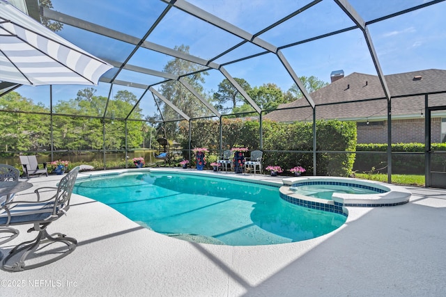 view of swimming pool with a patio area, glass enclosure, and a pool with connected hot tub