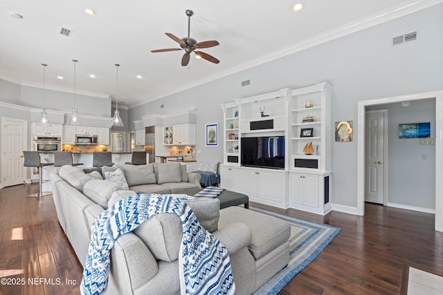 living room with recessed lighting, dark wood-style floors, visible vents, a ceiling fan, and ornamental molding
