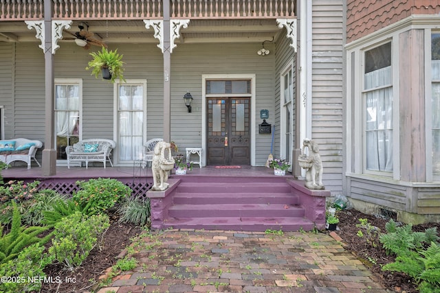 627 Emmett St, Palatka, FL 32177 - view of exterior entry with a porch, french doors, and ceiling fan