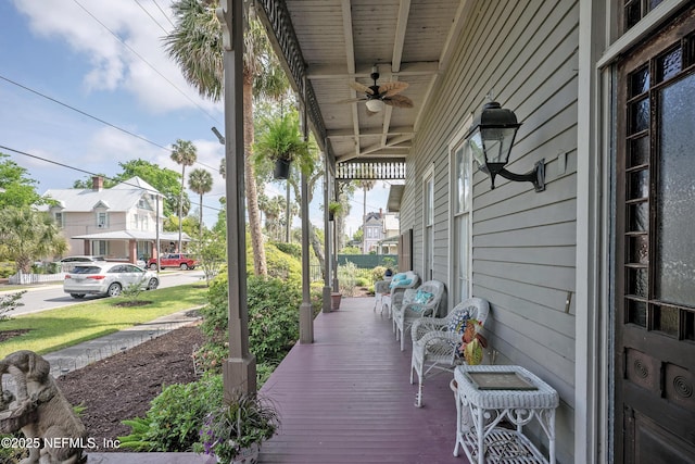 627 Emmett St, Palatka, FL 32177 - wooden deck featuring a porch and a ceiling fan