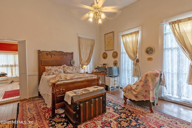 627 Emmett St, Palatka, FL 32177 - bedroom featuring wood-type flooring, wainscoting, and ceiling fan