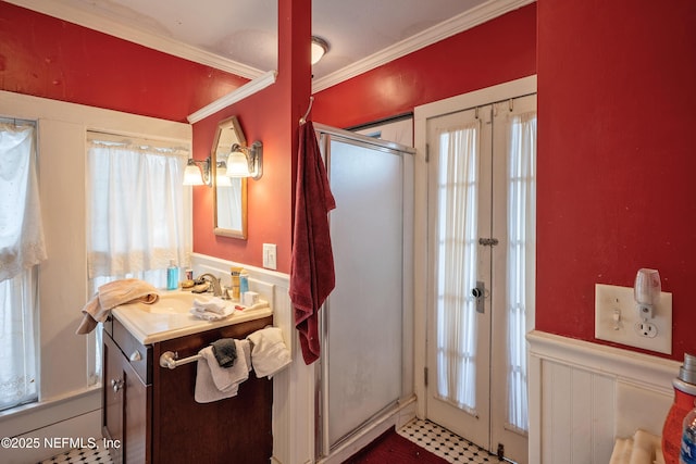 627 Emmett St, Palatka, FL 32177 - bathroom with crown molding, a shower stall, wainscoting, vanity, and french doors