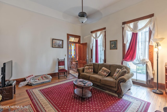 627 Emmett St, Palatka, FL 32177 - living area featuring ceiling fan, baseboards, and hardwood / wood-style flooring