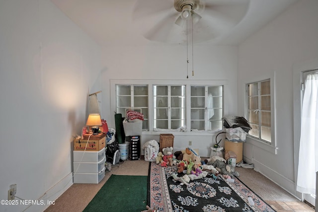 627 Emmett St, Palatka, FL 32177 - recreation room with baseboards, a ceiling fan, and carpet