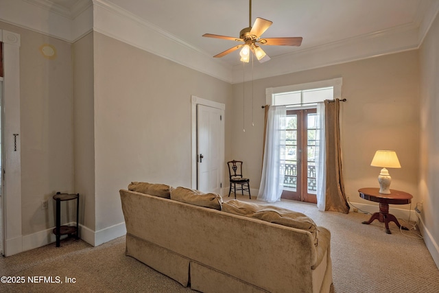 627 Emmett St, Palatka, FL 32177 - living room with light colored carpet, ceiling fan, baseboards, and ornamental molding