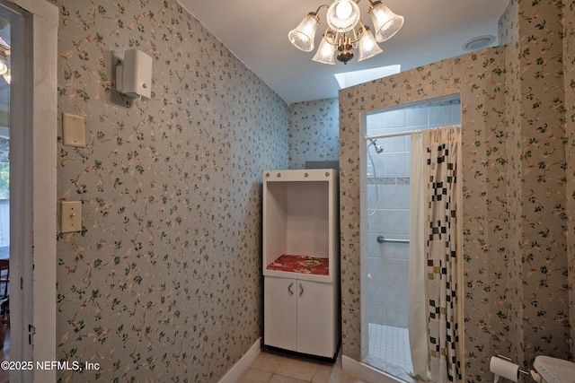 627 Emmett St, Palatka, FL 32177 - full bath featuring tile patterned floors, tiled shower, and wallpapered walls