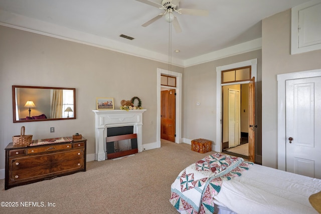627 Emmett St, Palatka, FL 32177 - carpeted bedroom with crown molding, visible vents, baseboards, and ceiling fan