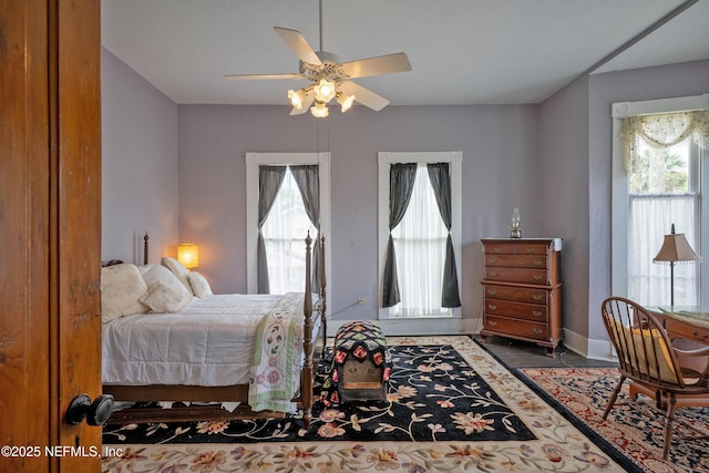 627 Emmett St, Palatka, FL 32177 - bedroom with multiple windows, baseboards, and a ceiling fan