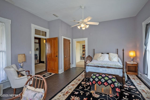 627 Emmett St, Palatka, FL 32177 - bedroom with wood finished floors, a ceiling fan, and visible vents