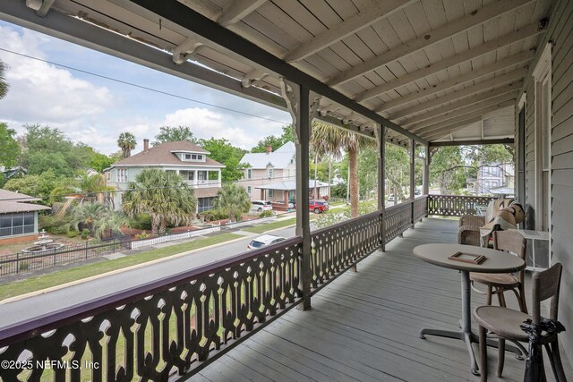 627 Emmett St, Palatka, FL 32177 - wooden deck with covered porch and a residential view