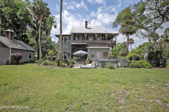 627 Emmett St, Palatka, FL 32177 - back of property with a yard, a patio, fence, a balcony, and a chimney