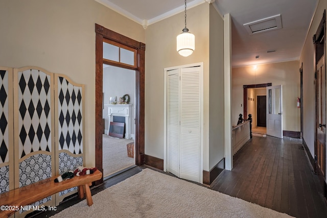 627 Emmett St, Palatka, FL 32177 - corridor featuring visible vents, baseboards, crown molding, and dark wood-style floors