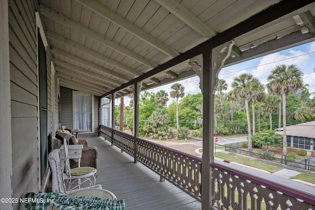 627 Emmett St, Palatka, FL 32177 - wooden deck featuring a porch