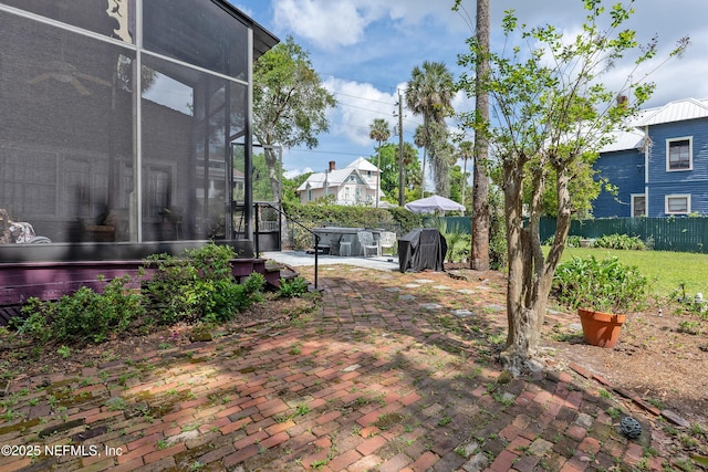 627 Emmett St, Palatka, FL 32177 - view of yard with a sunroom, a patio, and fence