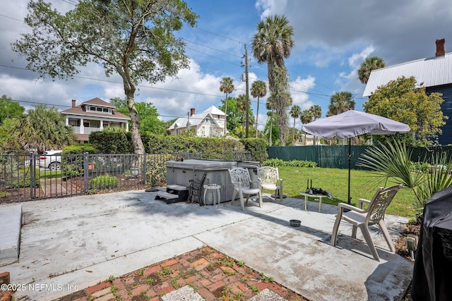627 Emmett St, Palatka, FL 32177 - view of patio / terrace featuring a fenced backyard and a hot tub