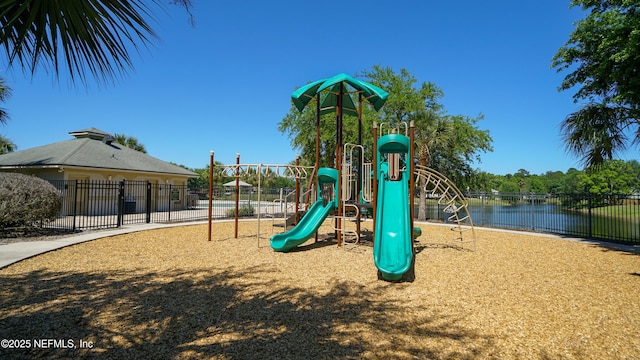 community play area with a water view and fence