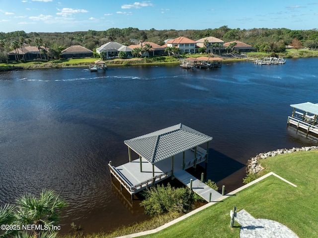 8 Island Estates Pkwy, Palm Coast, FL 32137 - dock area featuring a water view, a lawn, and boat lift