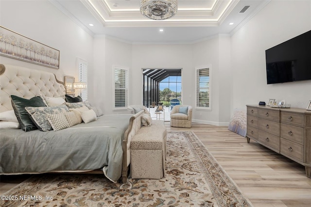 8 Island Estates Pkwy, Palm Coast, FL 32137 - bedroom with access to outside, light wood-style floors, a tray ceiling, ornamental molding, and visible vents