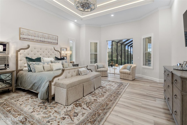 8 Island Estates Pkwy, Palm Coast, FL 32137 - bedroom with light wood-style flooring, crown molding, and multiple windows