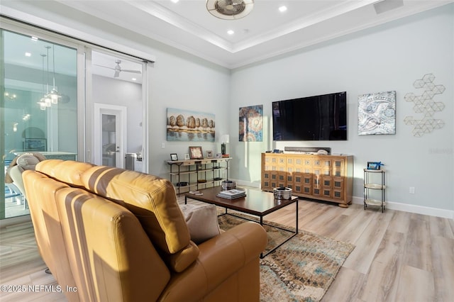 8 Island Estates Pkwy, Palm Coast, FL 32137 - living room featuring light wood-style floors, crown molding, a tray ceiling, recessed lighting, and baseboards