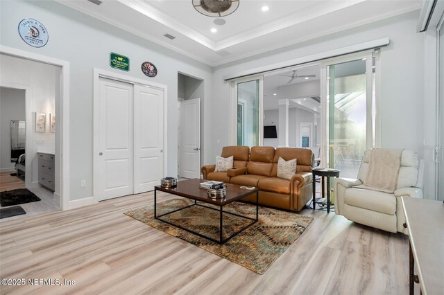 8 Island Estates Pkwy, Palm Coast, FL 32137 - living room with visible vents, a raised ceiling, crown molding, recessed lighting, and light wood finished floors