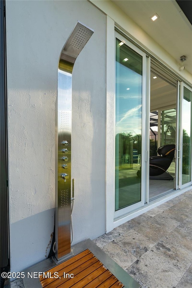 8 Island Estates Pkwy, Palm Coast, FL 32137 - doorway to property with stucco siding