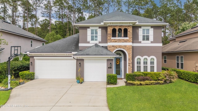 184 Rockcreek Dr, Saint Johns, FL 32259 - view of front facade featuring stone siding, stucco siding, driveway, and a garage