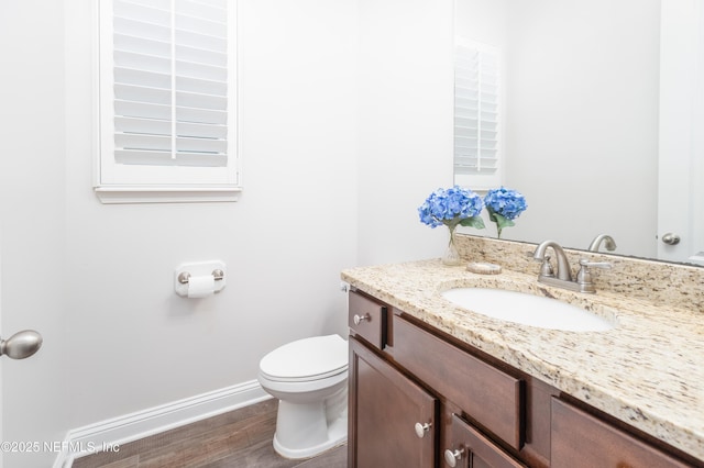 184 Rockcreek Dr, Saint Johns, FL 32259 - half bath featuring vanity, baseboards, toilet, and wood finished floors