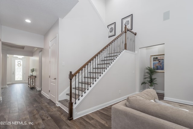 184 Rockcreek Dr, Saint Johns, FL 32259 - stairs featuring wood finished floors, baseboards, a high ceiling, and recessed lighting