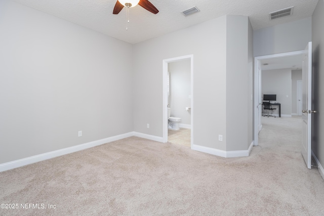 184 Rockcreek Dr, Saint Johns, FL 32259 - unfurnished bedroom featuring carpet flooring, a desk, baseboards, connected bathroom, and a textured ceiling